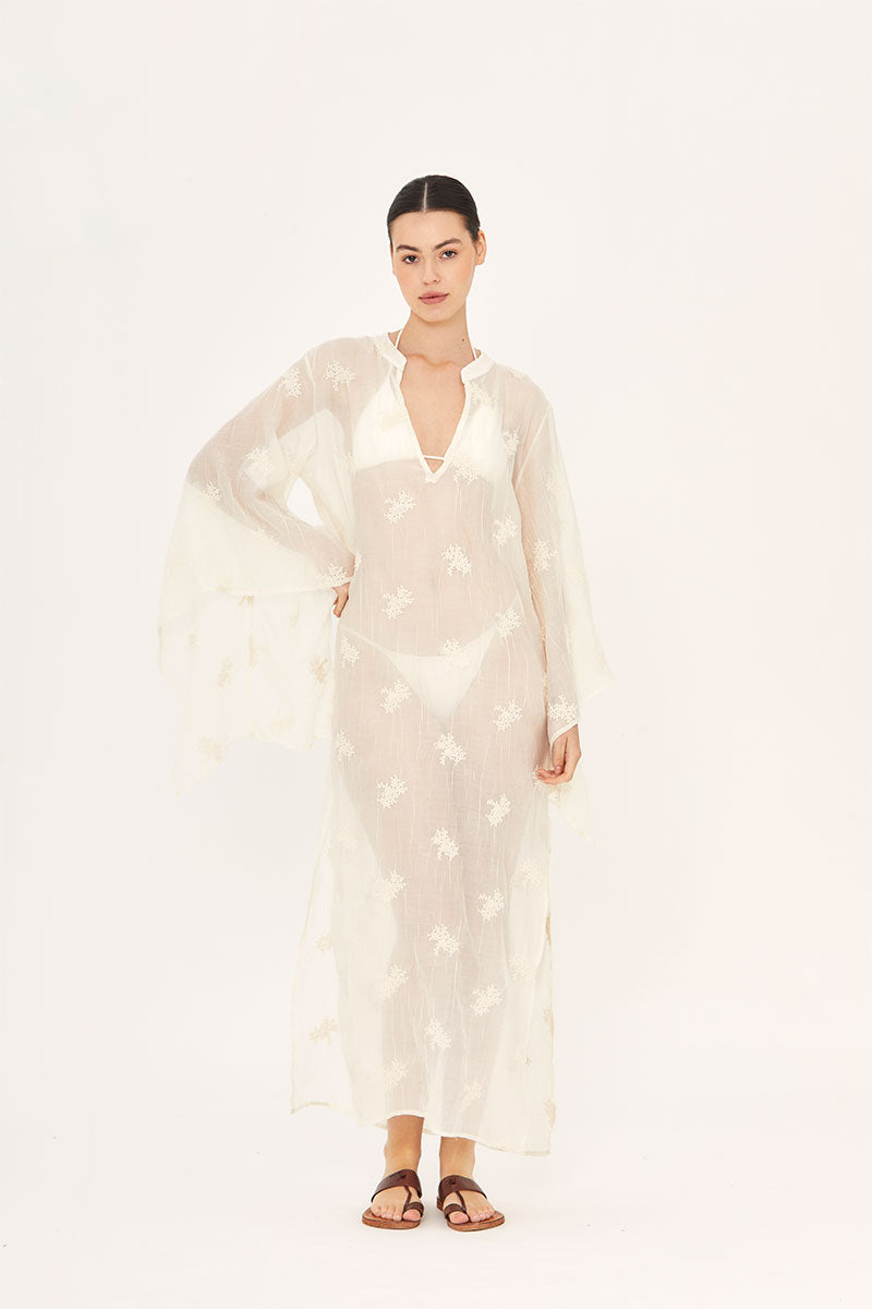 Aguaclara La Perle Long Kaftan cover-up in flowing fabric with intricate patterns, perfect for beach or resort wear.