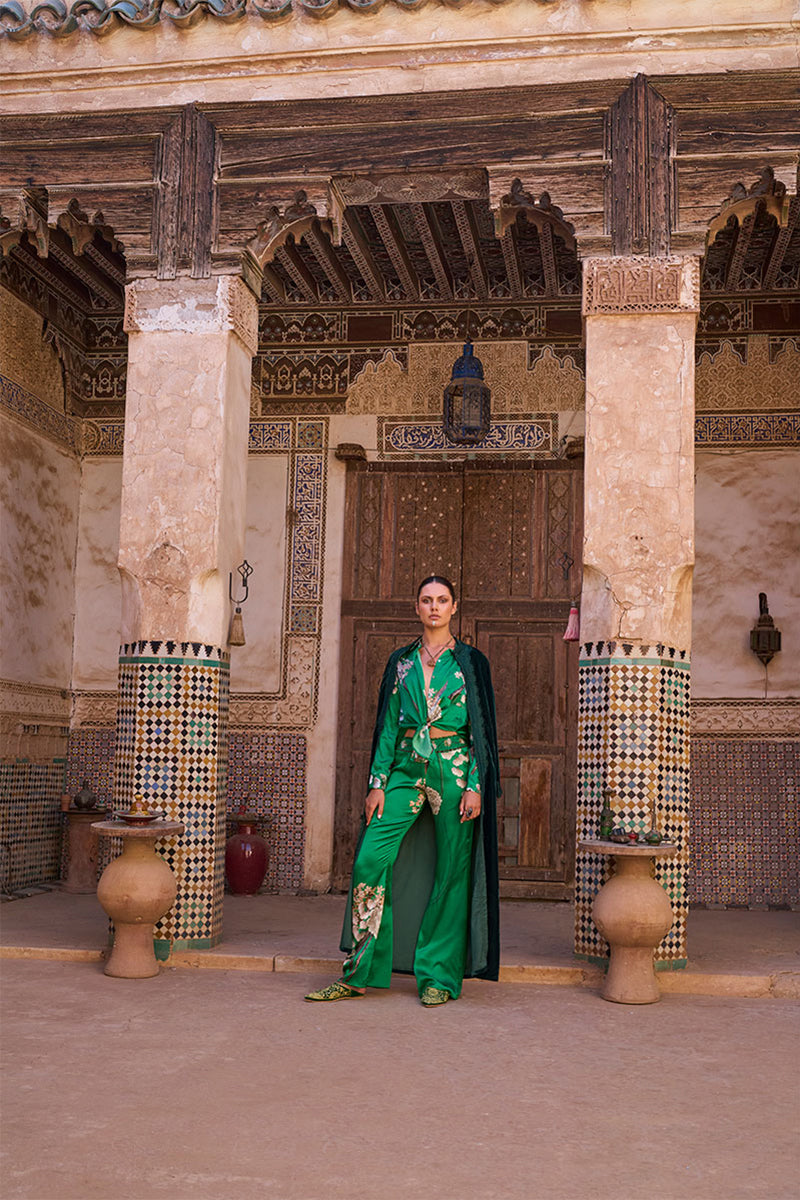 Aguaclara Jade pants with a relaxed fit, featuring a vibrant jade green color and stylish design, laid flat on a white background.