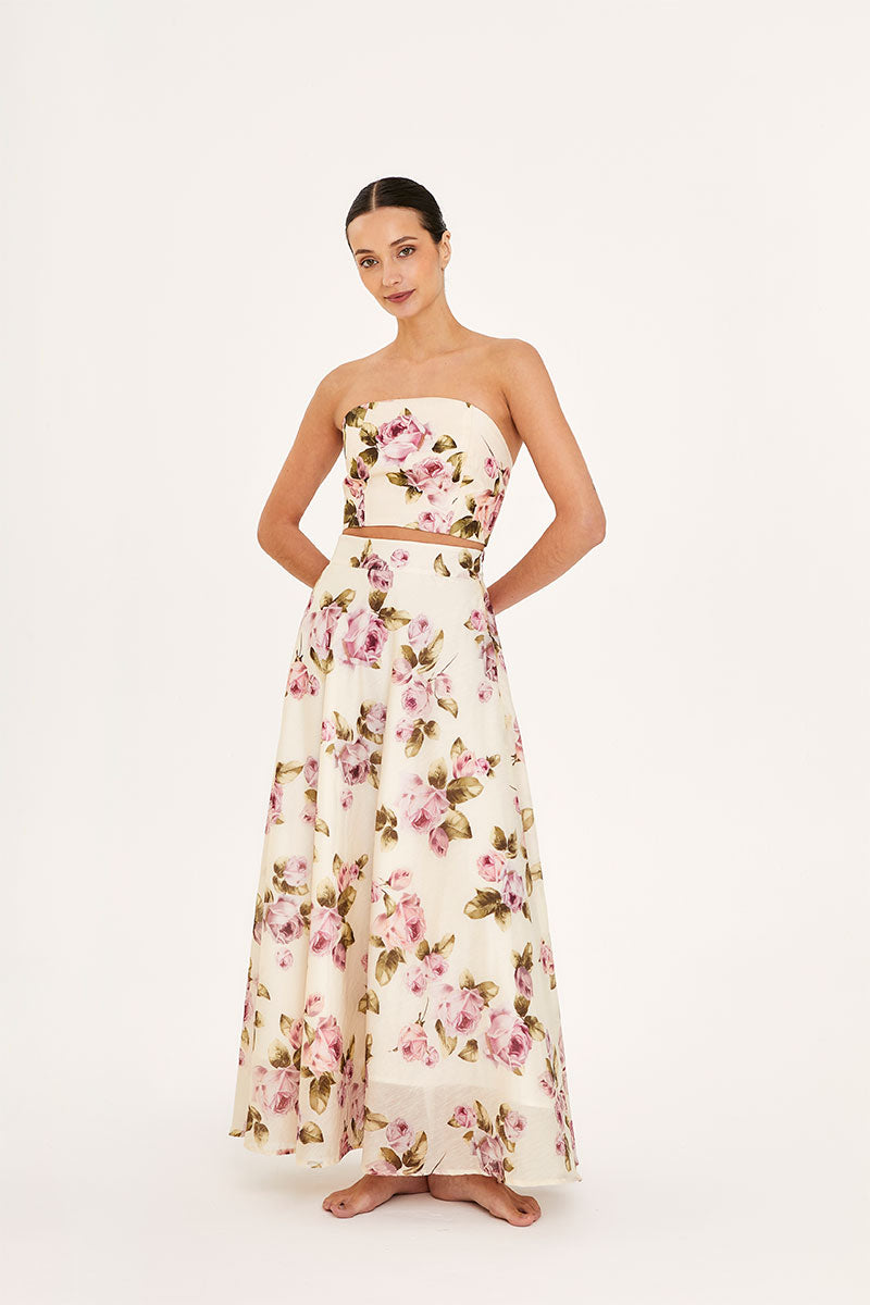 Aaguaclara Rose Maxi Skirt featuring floral pattern, flowing fabric, and high waist design, perfect for summer or casual wear.