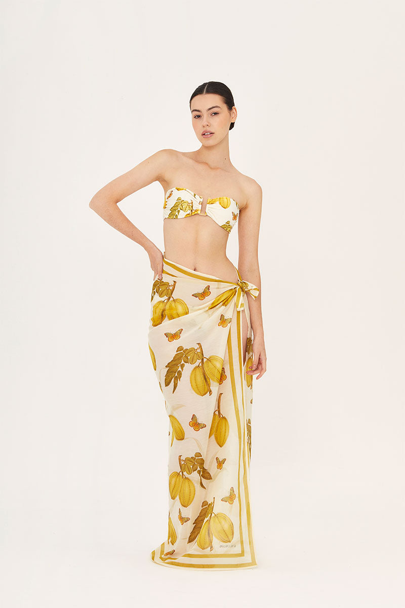Bright yellow Aguaclara L'EST PAREO cover-up with lightweight fabric, perfect for beach or poolside wear.
