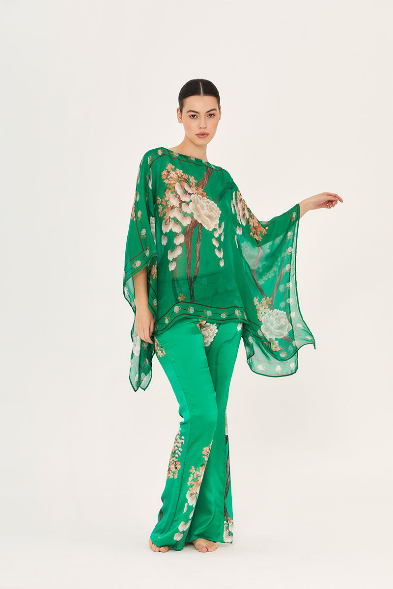 Aguaclara Jade Pants in vibrant fabric, featuring a relaxed fit and stylish design, shown on a model.