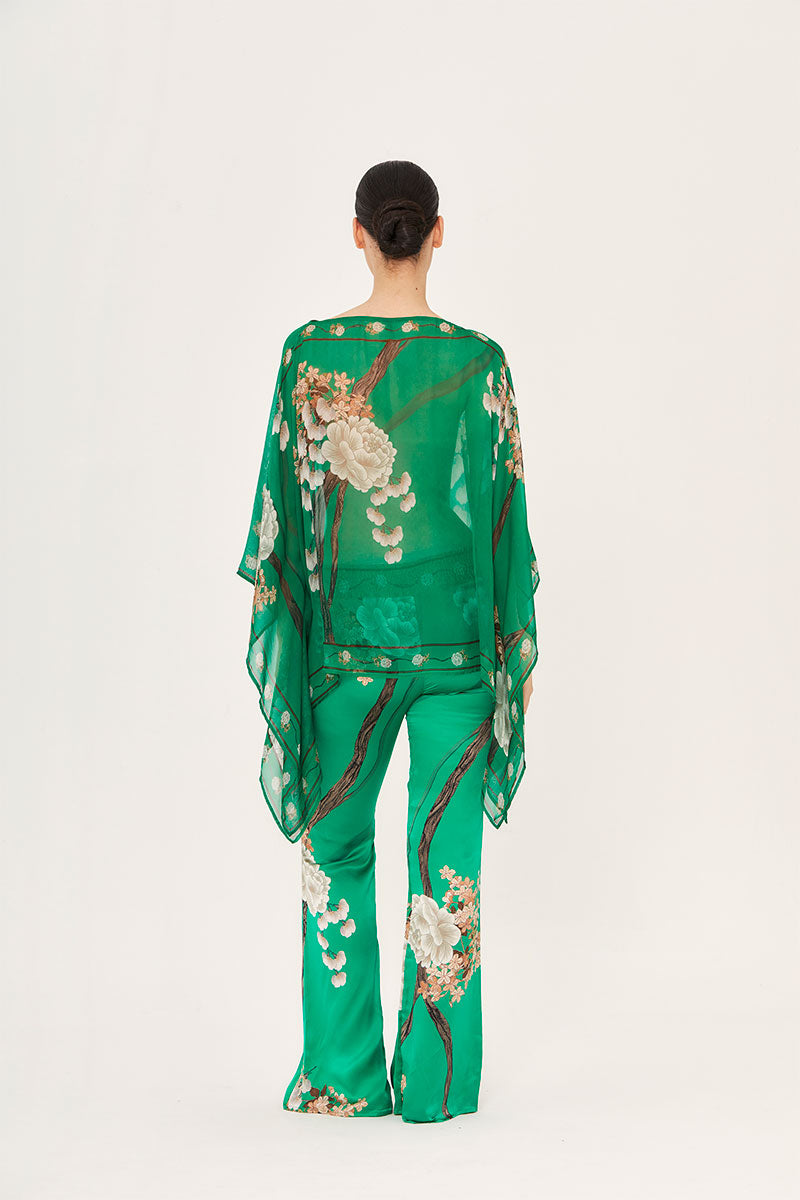 A pair of Aguaclara Jade Pants in a relaxed fit, featuring a smooth fabric and modern design, displayed on a neutral background.