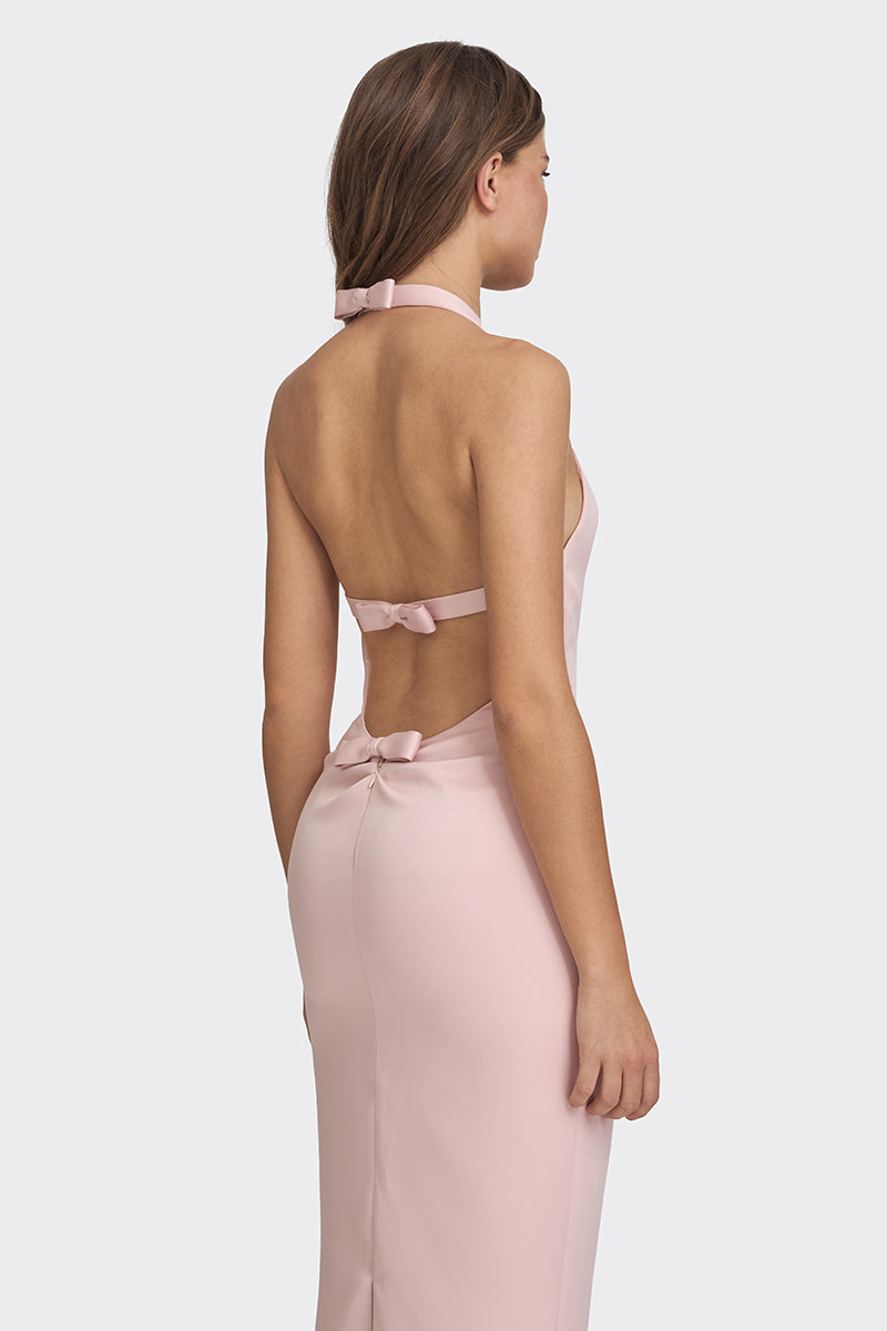 Dusty pink cake bow gown by Stolen Stores featuring a maxi dress with elegant bow details and flowing fabric.