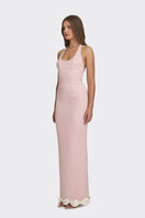 Dusty pink cake bow gown by Stolen Stores featuring a romantic maxi dress with elegant bow details and flowing fabric.