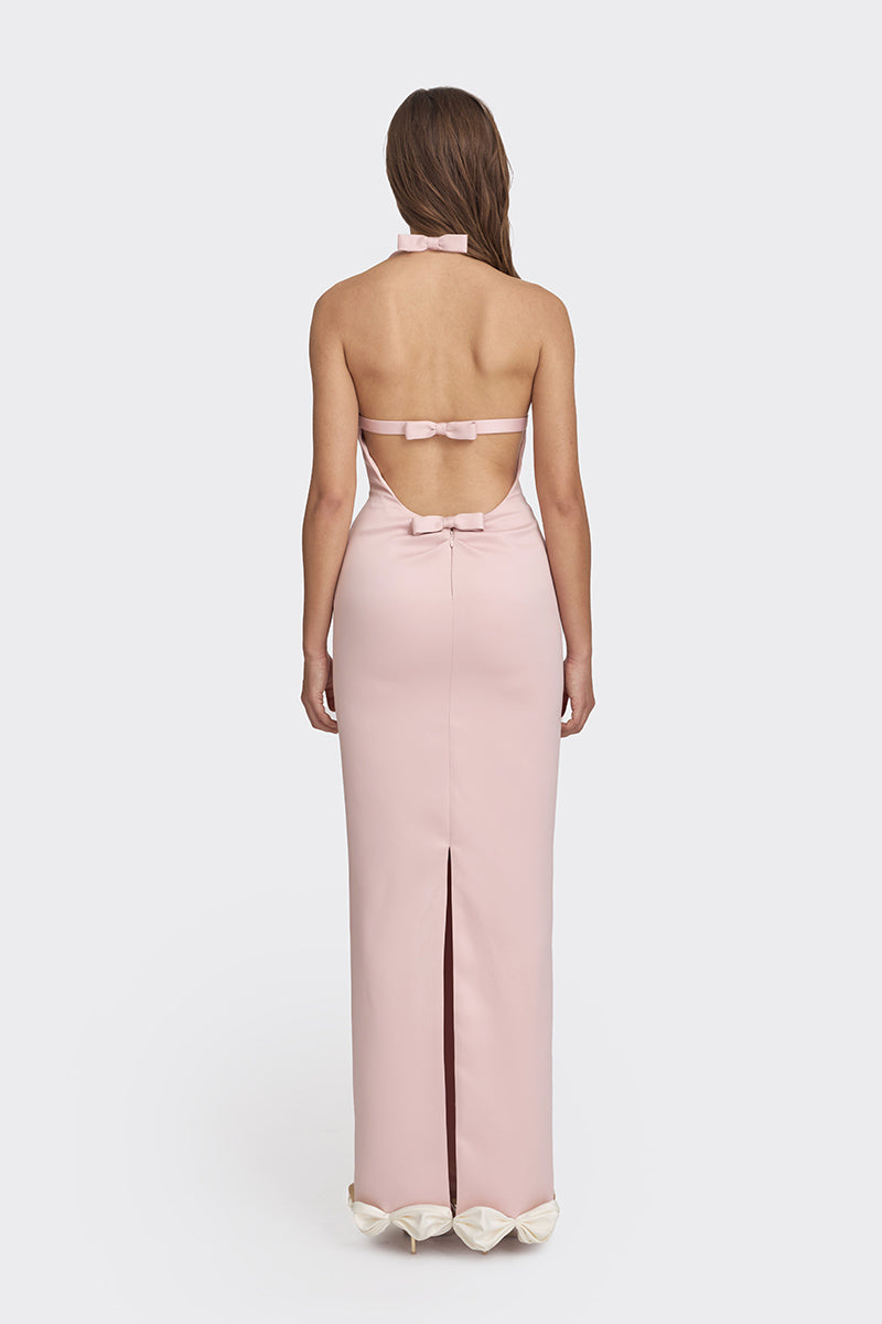 Dusty pink cake bow maxi gown by Stolen Stores featuring a flowy silhouette and elegant bow detail in a stylish evening dress.