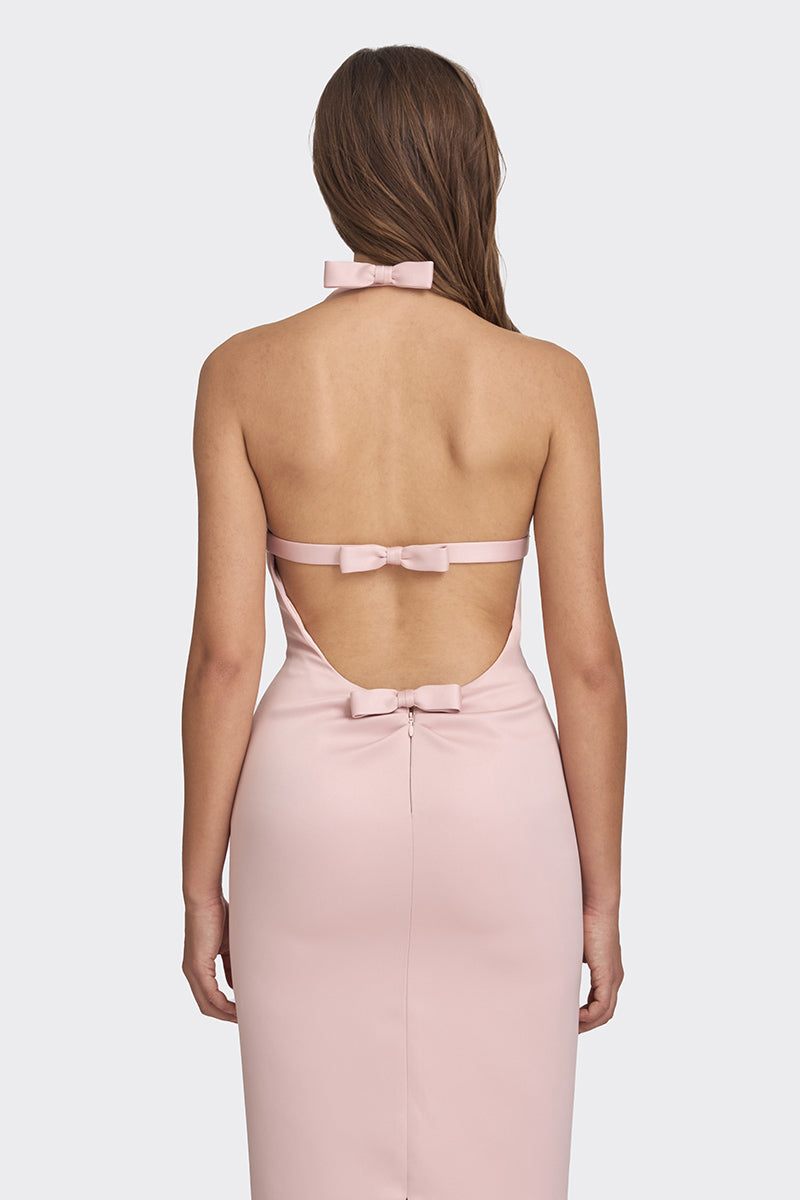 Dusty pink cake bow gown by Stolen Stores, featuring a flowy maxi dress with elegant bow detail and feminine silhouette.