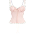 Light pink draped cake bustier top by Stolen Stores, showcasing a fitted design with elegant fabric detailing.