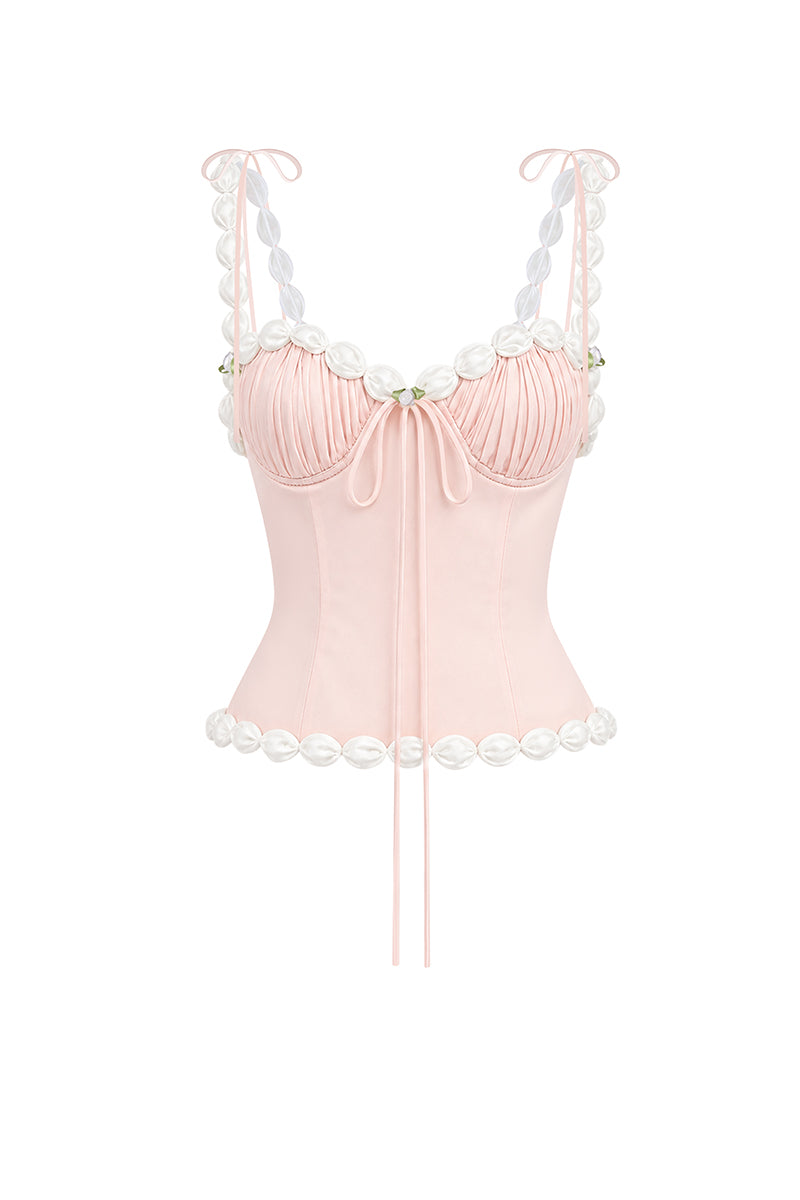 Light pink draped cake bustier top by Stolen Stores, showcasing a fitted design with elegant fabric detailing.