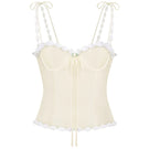 Light yellow cake bustier top from Stolen Stores, featuring a fitted design and stylish strapless silhouette.