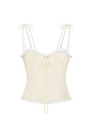 Light yellow cake bustier top from Stolen Stores, featuring a fitted design and stylish strapless silhouette.