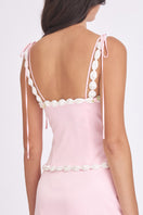 Light pink cake bustier top by Stolen Stores featuring a fitted design and decorative cake-inspired details.