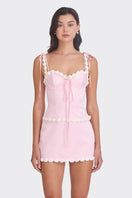 Light pink cake bustier top by Stolen Stores, featuring a fitted design with decorative details and adjustable straps.