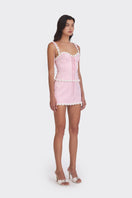 Light pink cake bustier top by Stolen Stores featuring a fitted design and decorative details.