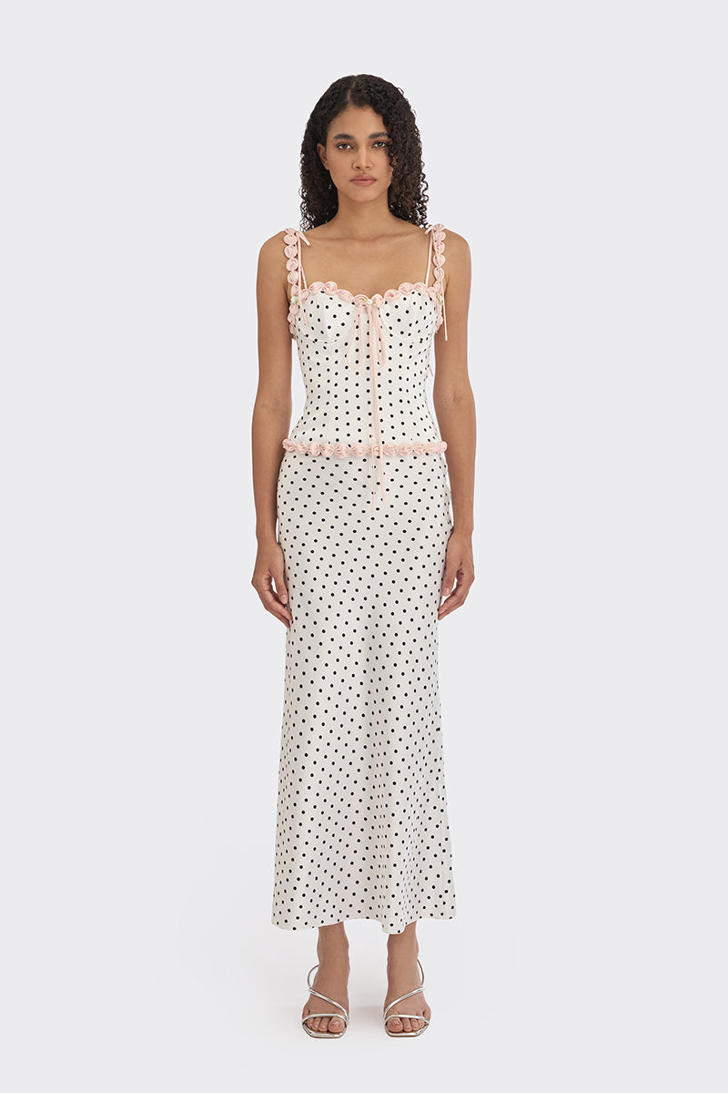 White polka dot bustier top by Stolen Stores featuring a cake-inspired design with a fitted silhouette.