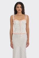 White polka dot bustier top from Stolen Stores featuring cake-inspired design with a fitted, stylish silhouette.