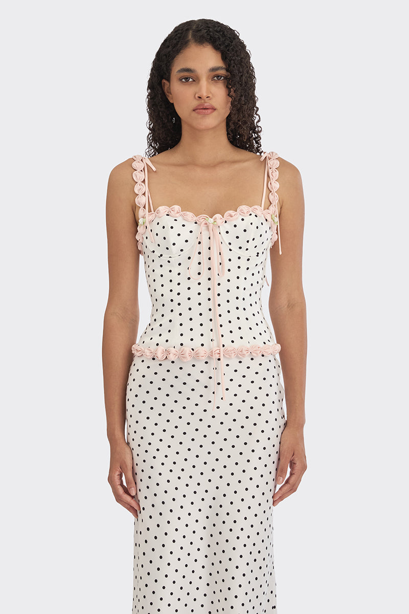 White polka dot bustier top from Stolen Stores featuring cake-inspired design with a fitted, stylish silhouette.