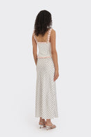 White polka dot bustier top by Stolen Stores featuring a fitted design and adjustable straps.