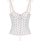 White polka dot bustier top by Stolen Stores featuring a cake-inspired design with polka dot pattern.