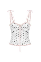 White polka dot bustier top by Stolen Stores featuring a cake-inspired design with polka dot pattern.