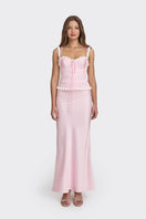 Light pink cake bustier top by Stolen Stores, featuring a fitted design and stylish neckline, shown on a model.