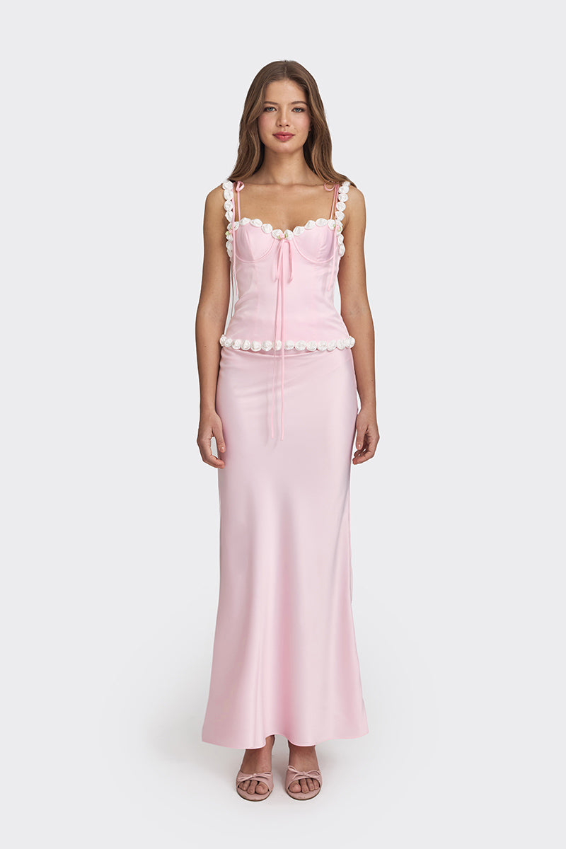 Light pink cake bustier top by Stolen Stores, featuring a fitted design and stylish neckline, shown on a model.