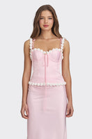 Light pink cake bustier top by Stolen Stores, featuring a fitted design and stylish details, displayed on a neutral background.