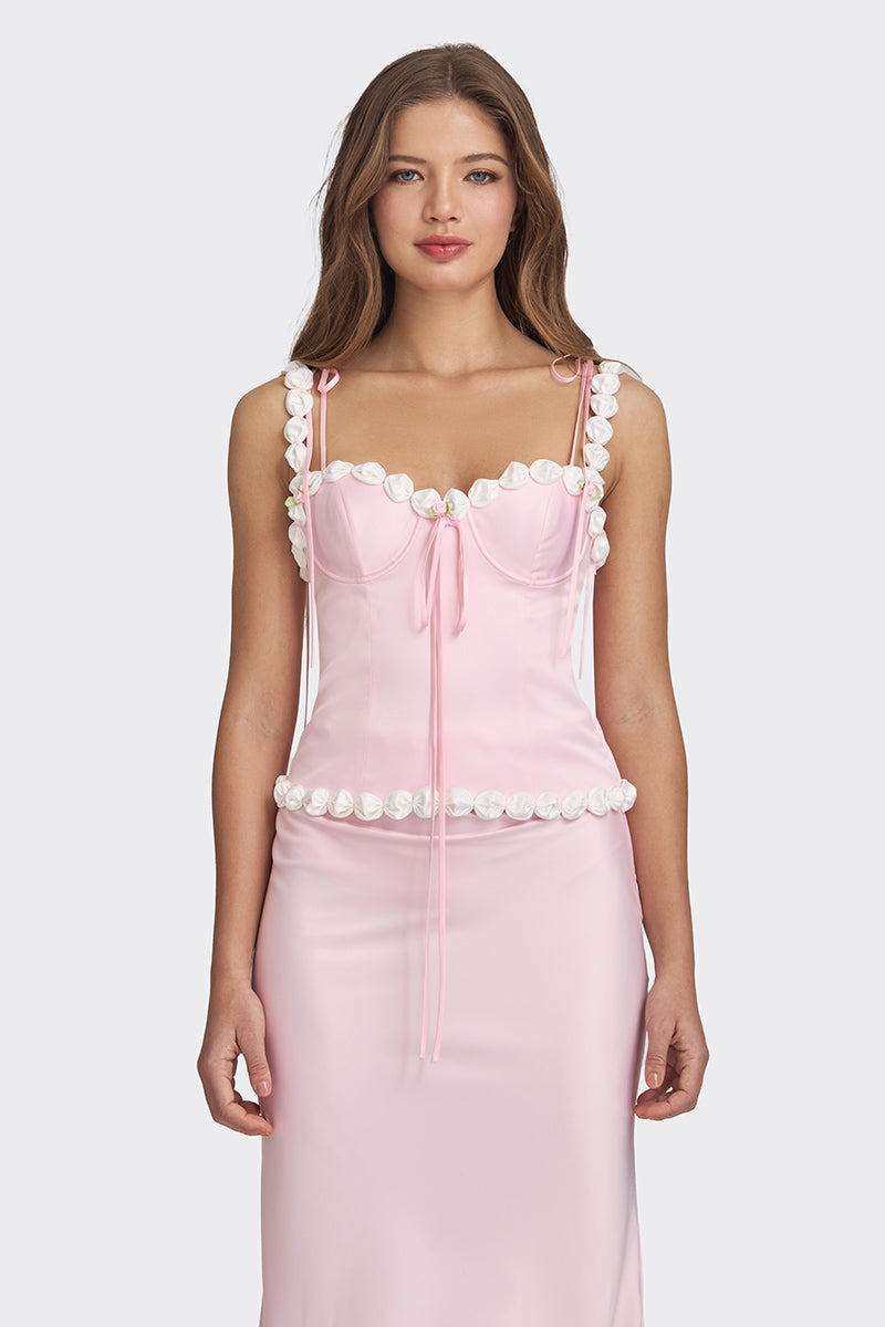 Light pink cake bustier top by Stolen Stores, featuring a fitted design and stylish details, displayed on a neutral background.