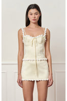 Light yellow cake bustier top by Stolen Stores, featuring a fitted design and stylish details, perfect for trendy fashion looks.