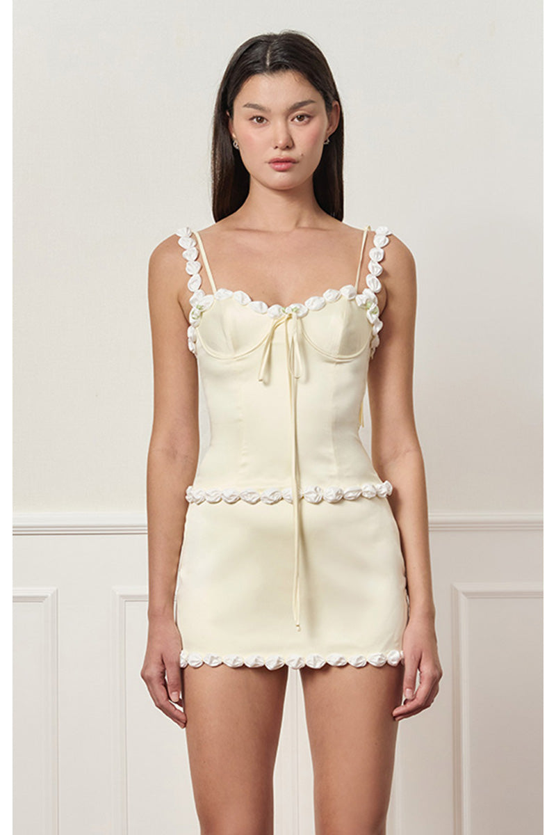 Light yellow cake bustier top by Stolen Stores, featuring a fitted design and stylish details, perfect for trendy fashion looks.
