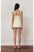Light yellow cake bustier top by Stolen Stores, featuring a fitted design and stylish neckline, displayed on a mannequin.