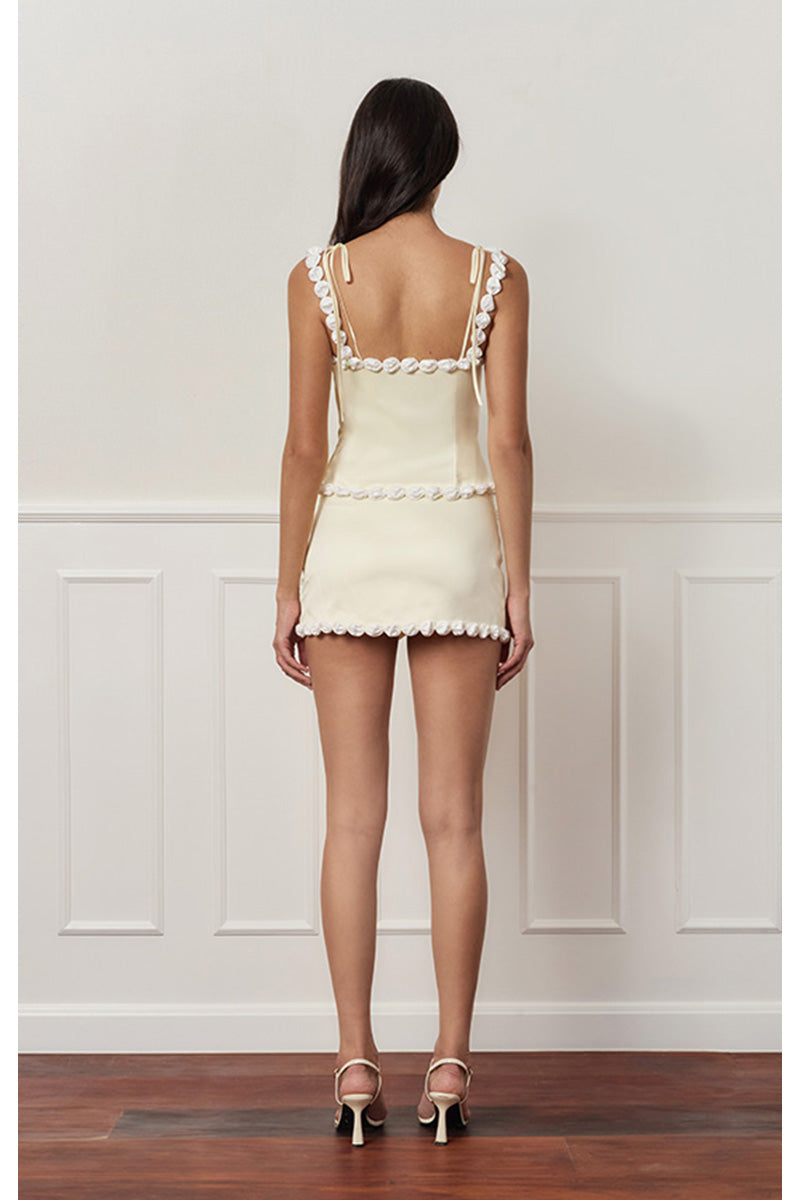 Light yellow cake bustier top by Stolen Stores, featuring a fitted design and stylish neckline, displayed on a mannequin.