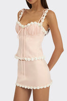 Light pink draped cake bustier top by Stolen Stores, stylish sleeveless design with elegant draping details.
