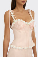 Light pink draped cake bustier top from Stolen Stores, featuring a stylish, fitted design with elegant draping details.