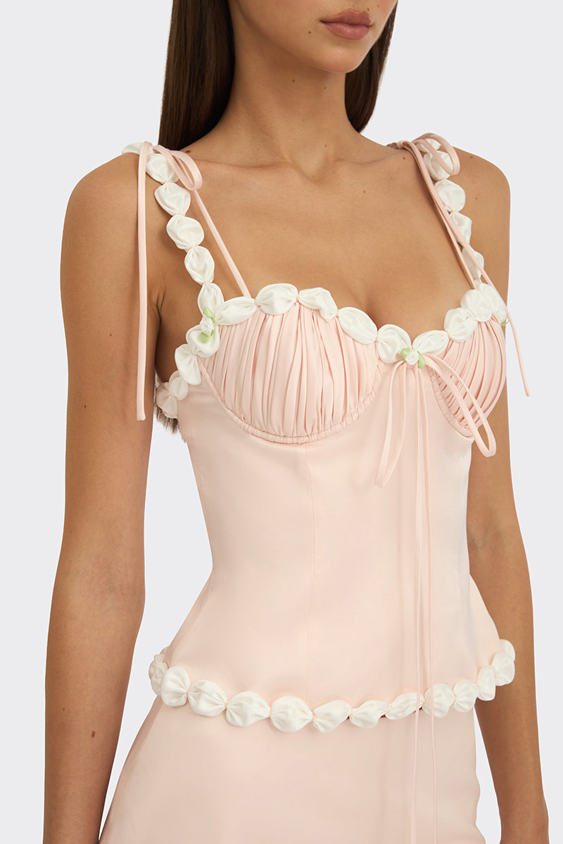 Light pink draped cake bustier top from Stolen Stores, featuring a stylish, fitted design with elegant draping details.