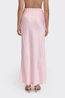 Light pink Cake maxi skirt from Stolen Stores, featuring a flowing design and stylish waistband, shown on a model.