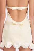 Light yellow Cake Bow mini dress from Stolen Stores featuring a fitted silhouette and stylish design.