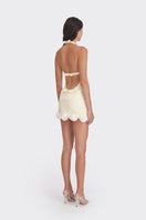 Light yellow Cake Mini Dress by Stolen Stores, featuring a fitted silhouette and stylish design perfect for warm-weather wear.