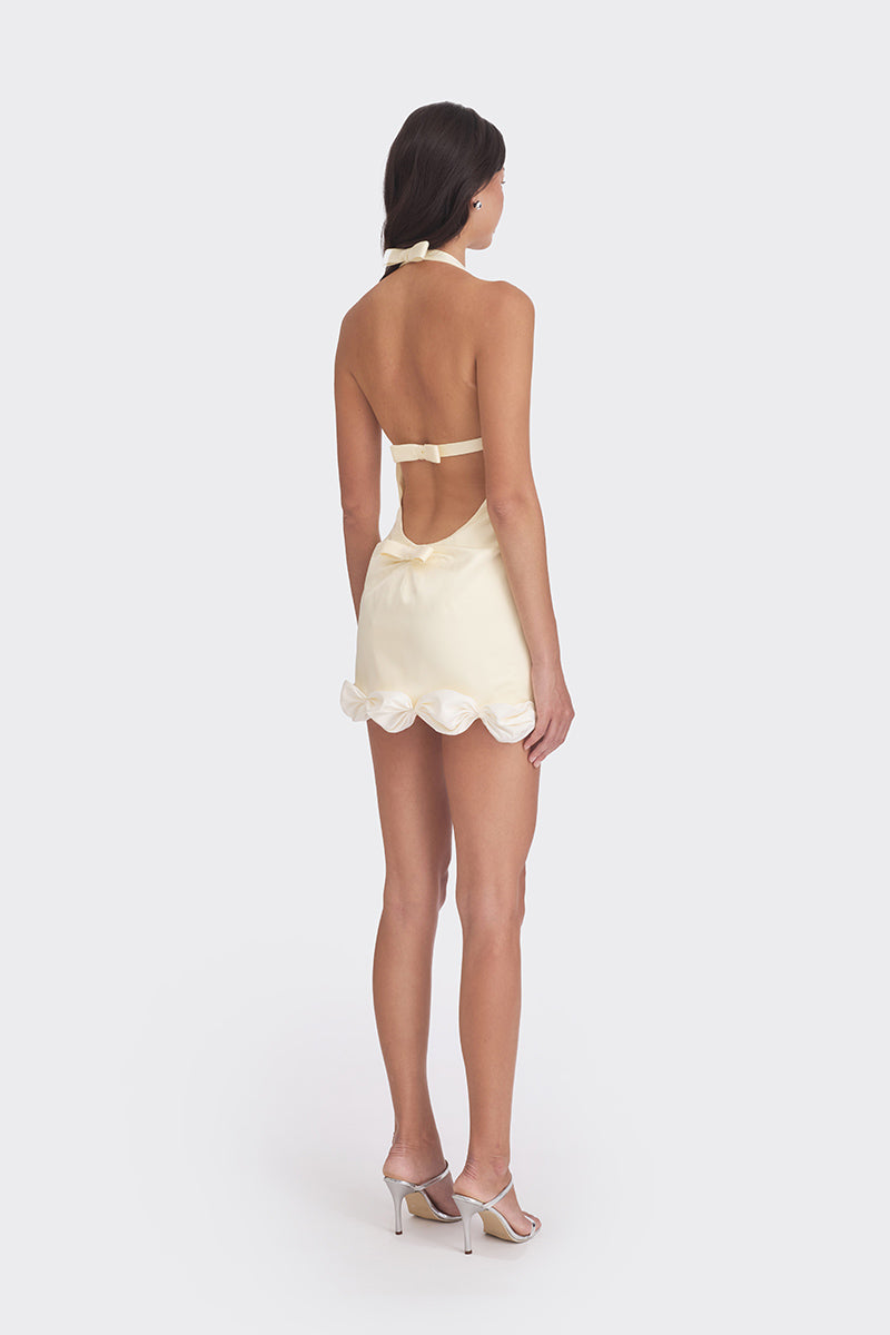 Light yellow Cake Mini Dress by Stolen Stores, featuring a fitted silhouette and stylish design perfect for warm-weather wear.