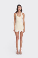 Light yellow Cake Bow mini dress by Stolen Stores, featuring a fitted silhouette and stylish design, shown on a mannequin.