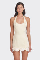 Light yellow Cake Bow mini dress by Stolen Stores, stylish sleeveless dress with a fitted silhouette and playful ruffle details.