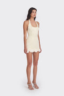 Light yellow Cake Bow mini dress by Stolen Stores, featuring a fitted silhouette and stylish design for casual or semi-formal wear.
