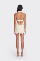 Light yellow Cake mini dress by Stolen Stores, featuring a fitted silhouette and stylish design, shown on a model.