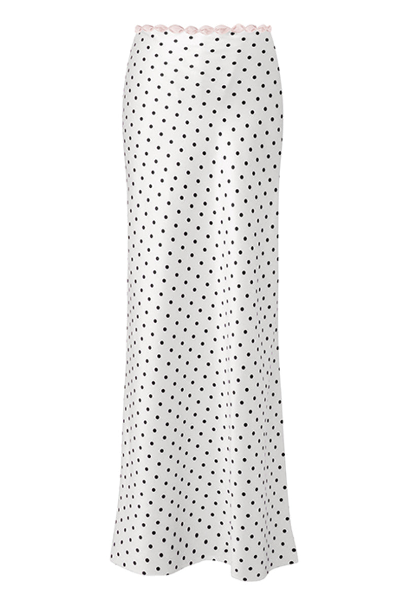 White Cake Maxi Skirt with black polka dots, flowing design, by Stolen Stores, styled with a casual top and accessories.