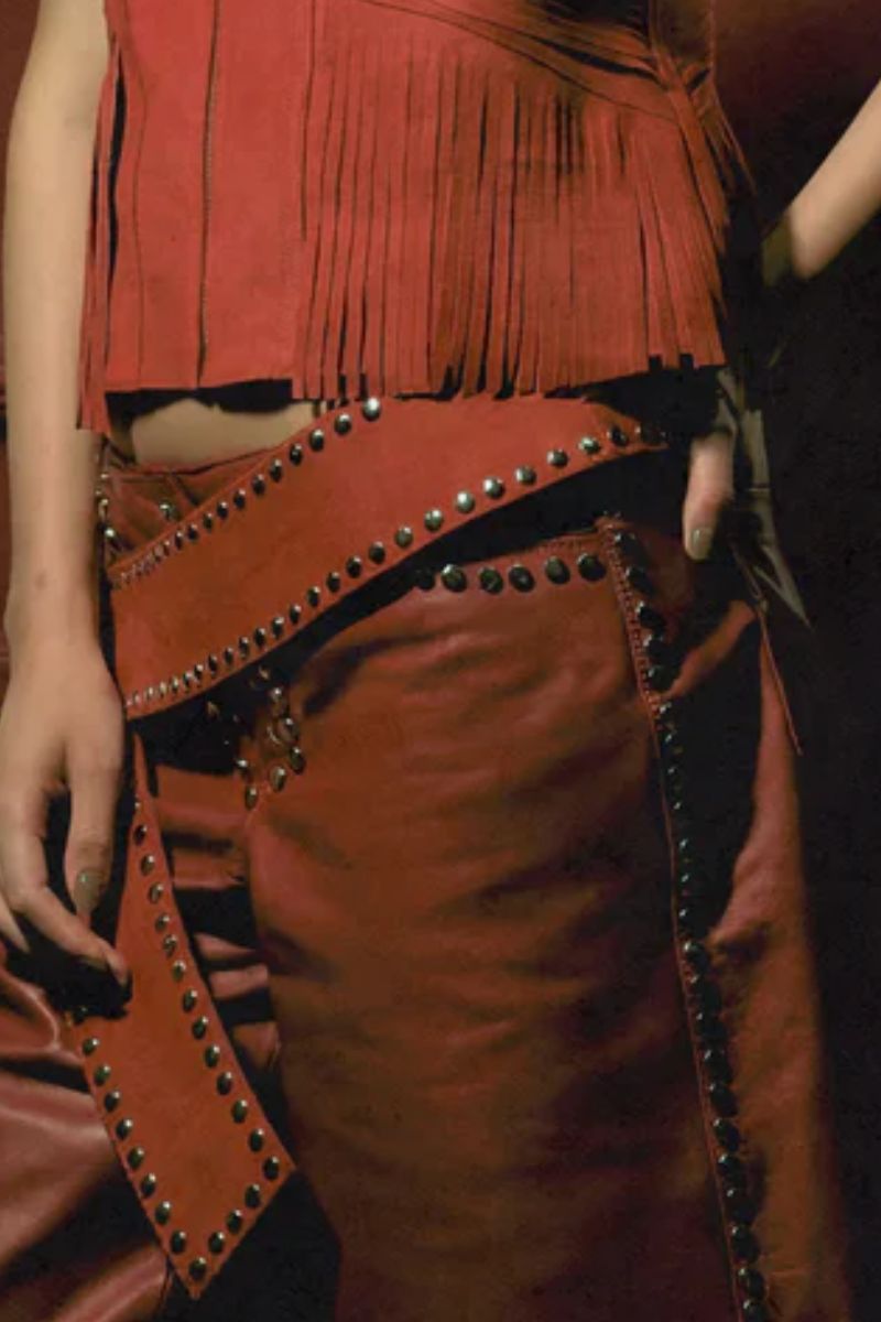 Red leather studded shorts by Double A featuring a stylish fit and metal stud details, perfect for a trendy casual look.