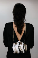Elegant Calypso Mother of Pearl clutch by Freya Rose featuring a sleek design and shimmering pearl finish.