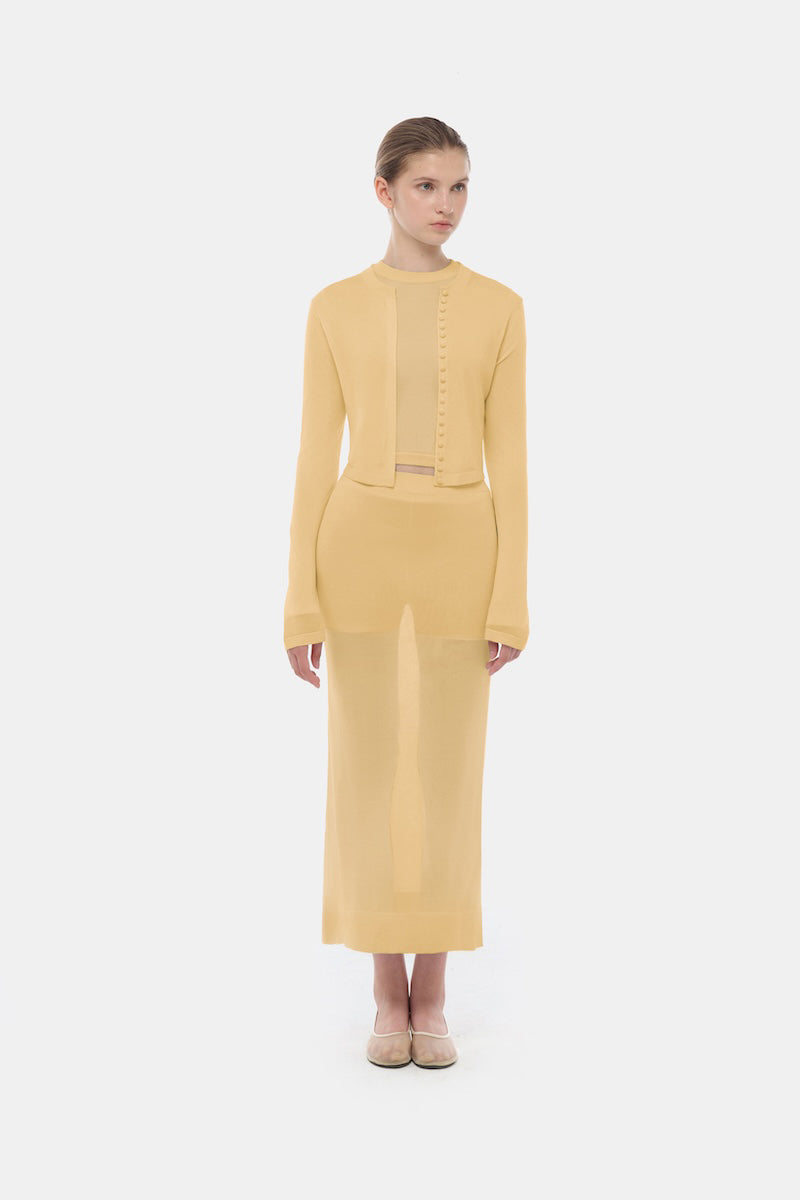 Camel button-up crop cardigan by Montsand, showing the knit fabric and front button closure on a casual tops display.