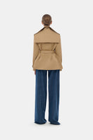 Montsand camel trench jacket displayed on a hanger, featuring classic design and lightweight fabric for stylish outerwear.