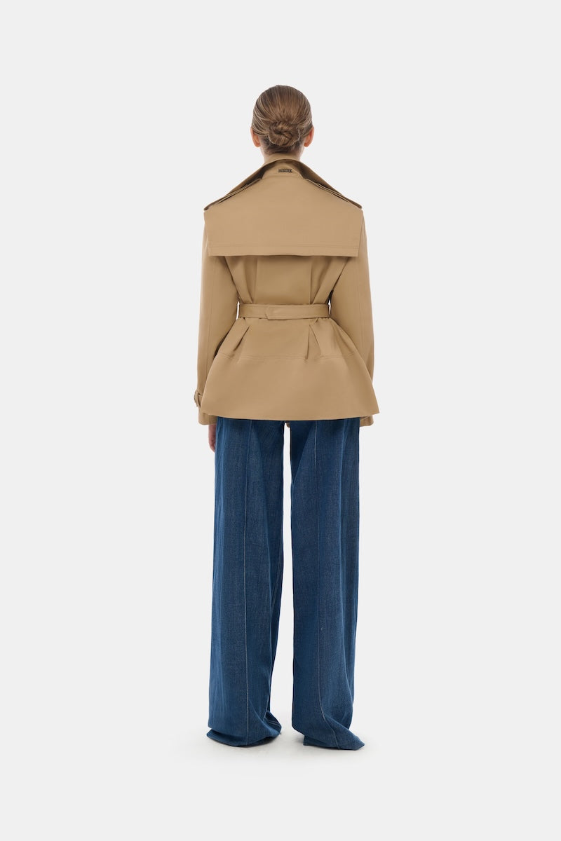 Montsand camel trench jacket displayed on a hanger, featuring classic design and lightweight fabric for stylish outerwear.