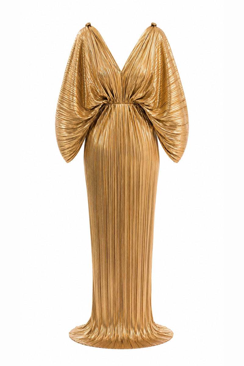 Gold Candela dress by Maylé Vásquez, elegant gown with intricate details, perfect for formal occasions