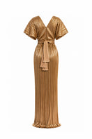 Maylé Vásquez Candela dress in gold, elegant gown with flowing fabric and intricate details, perfect for formal occasions.